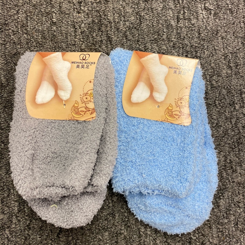 Two pairs of fuzzy socks blue and gray
